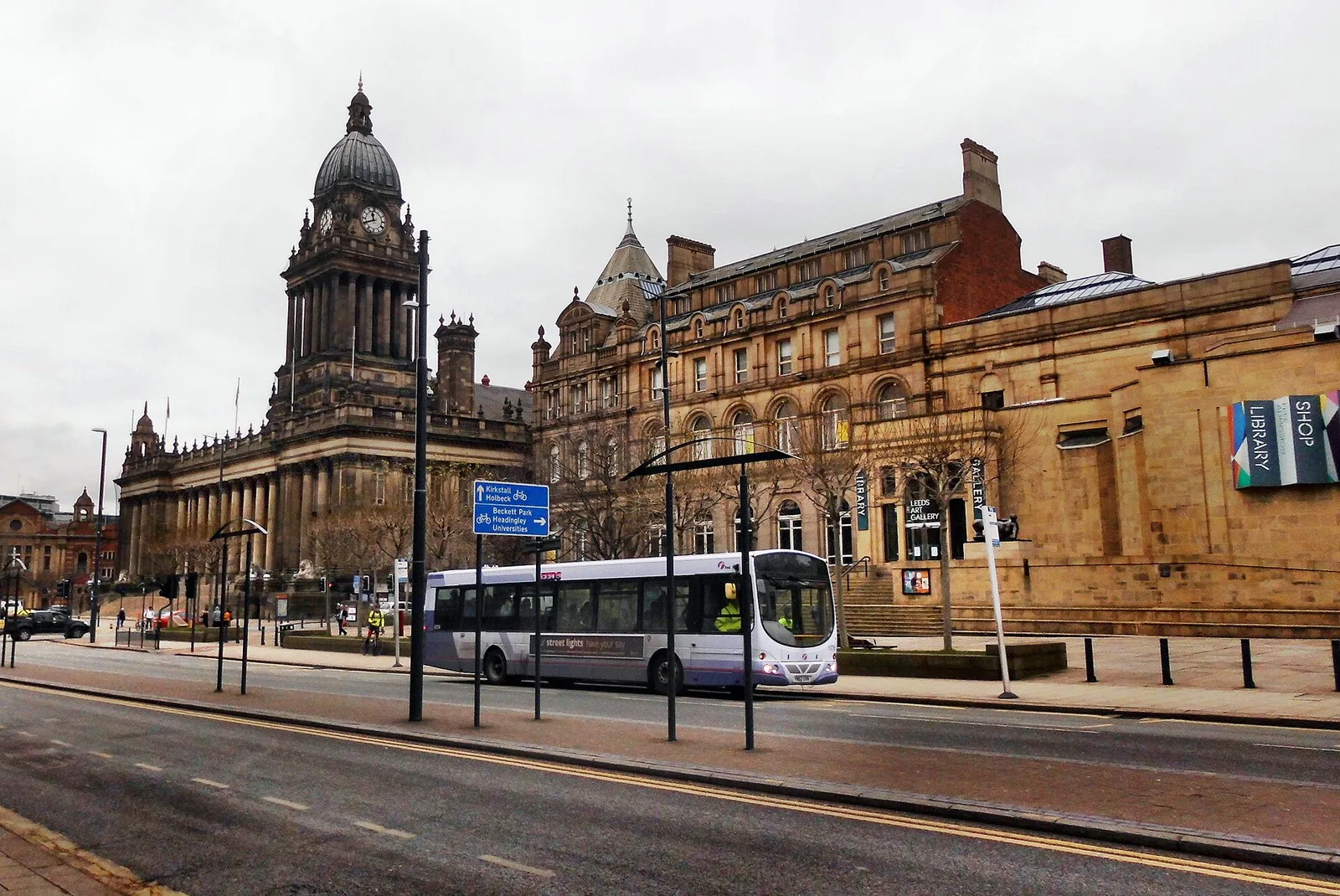 Leeds Town Hall and the Headrow seen from the street, with a bus passing